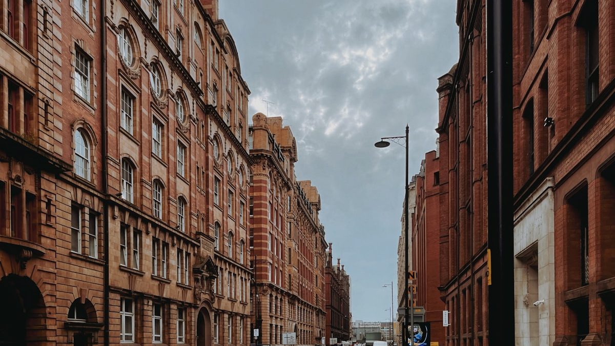 A street of red-brick terraced houses, typical of homes converted into HMOs in northern English cities.