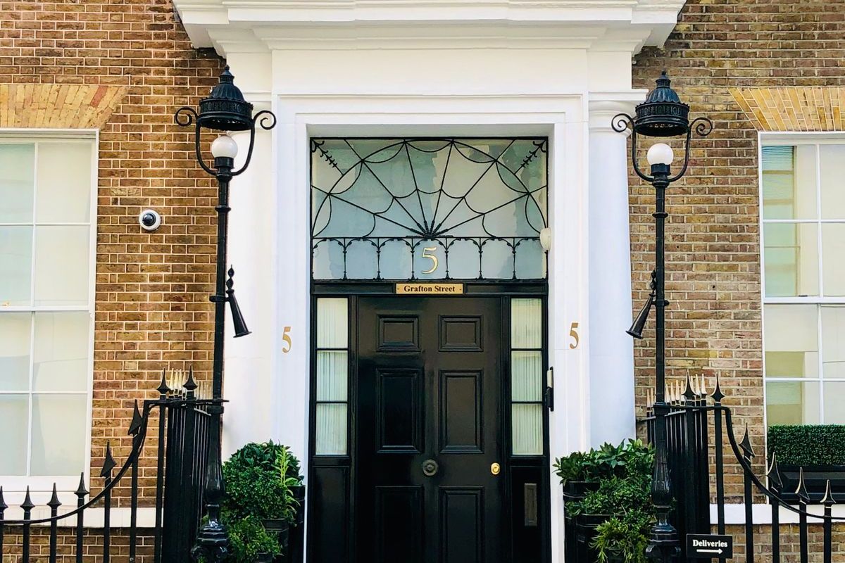 The front door and steps of a period townhouse