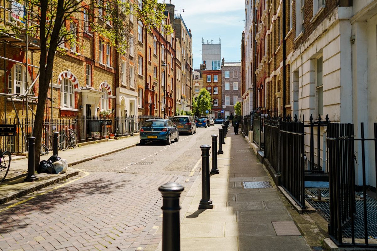 A quiet residential street of red-brick houses